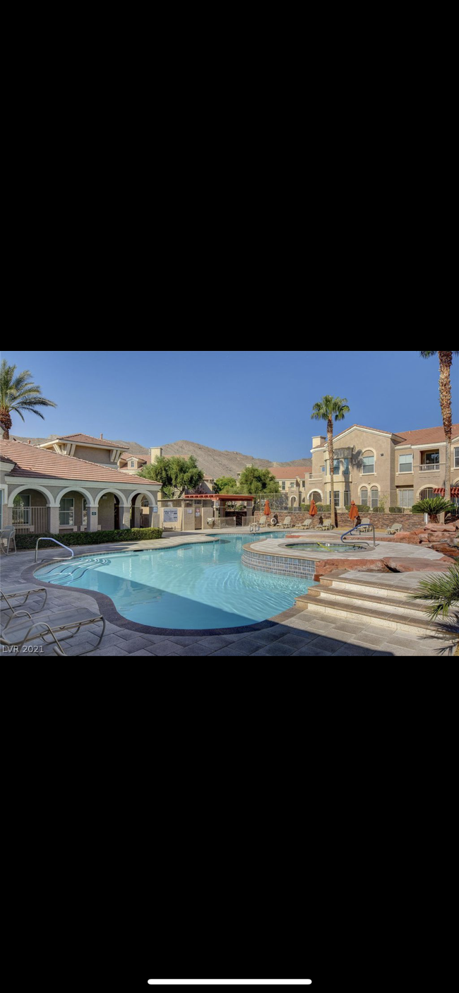 Pool with grills and chairs - 10550 W Alexander Rd