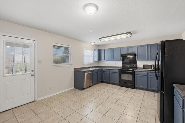 Building Photo - 4BR Home with Open Living Area & Included Appliances