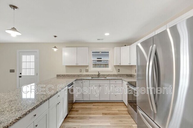 Building Photo - 6961 Raymond Ave