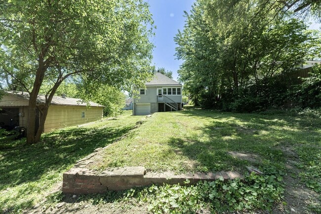 Building Photo - Remodeled 2-Bedroom Bungalow with Spacious Yard & 1-Car Basement Garage