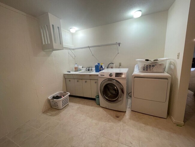 Building Photo - Spacious, four-bedroom, two-bathroom, coun...