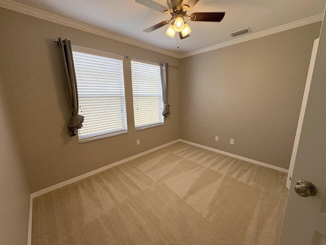 Building Photo - Spacious 5-Bedroom Pool Home with Putting ...
