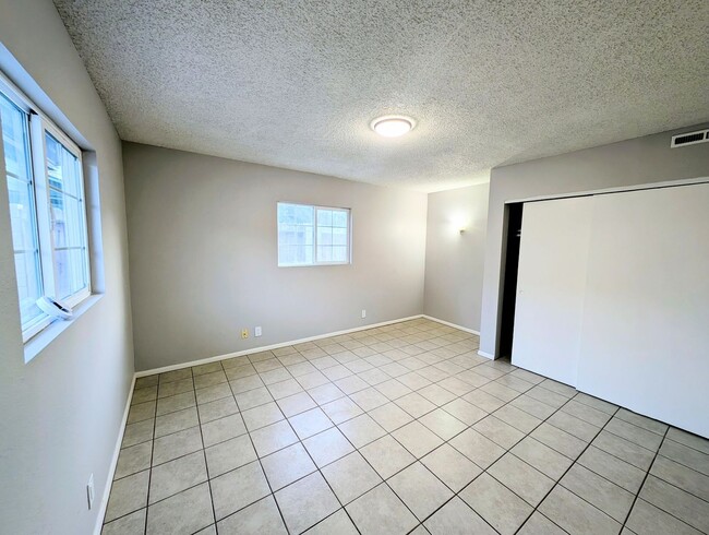 Building Photo - 4-bedroom house with a 2-car garage availa...