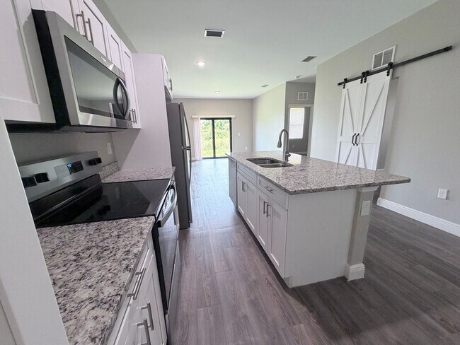 Building Photo - $200 off 2nd months rent! Like New 2 Bedroom 2 Bath w/ den and garage!