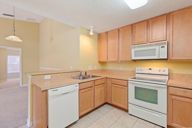 Building Photo - Beautifully Updated & Spacious 3BR/2BA Condo in a Secure Gated Community — Includes Cable, Intern...