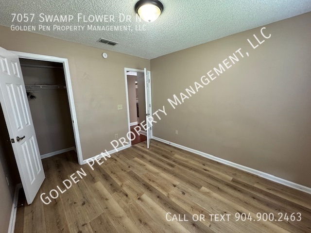 Building Photo - 7057 Swamp Flower Dr N