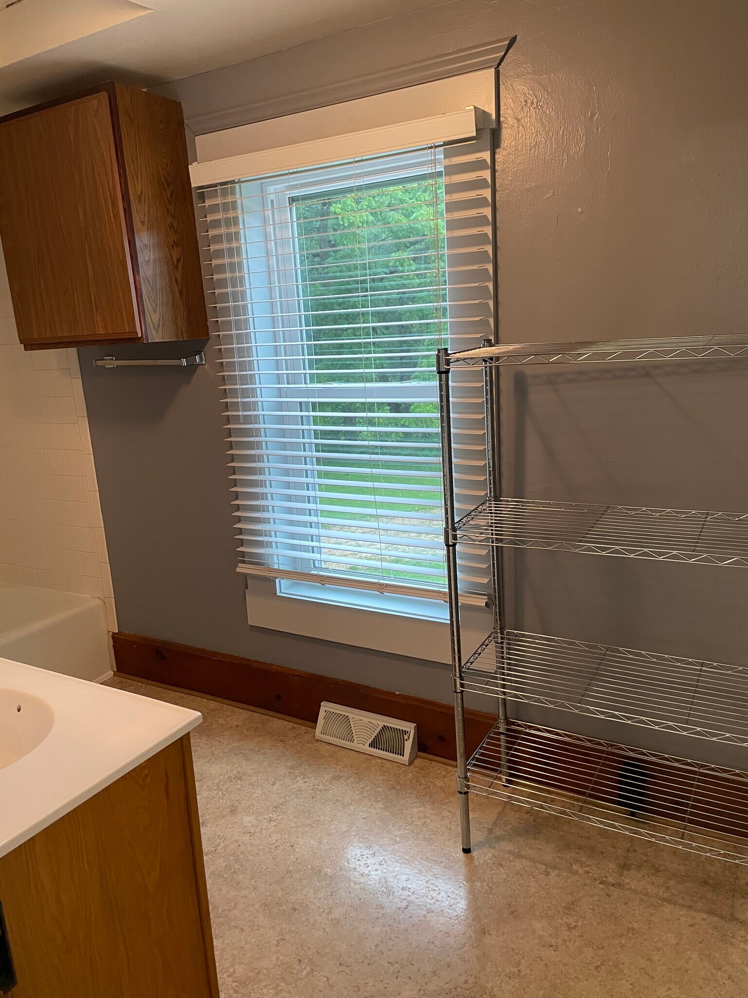 Bathroom with linen storage shelving - 17286 Hope Rd