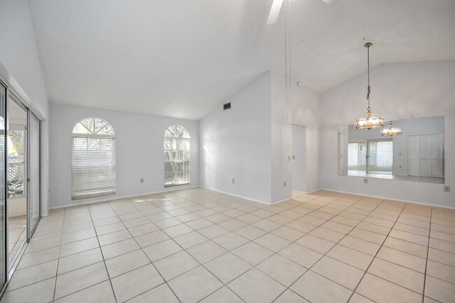 Building Photo - Beautiful Must See!! 3/2 Plus Sunroom & Garage!!  Gated Community!!