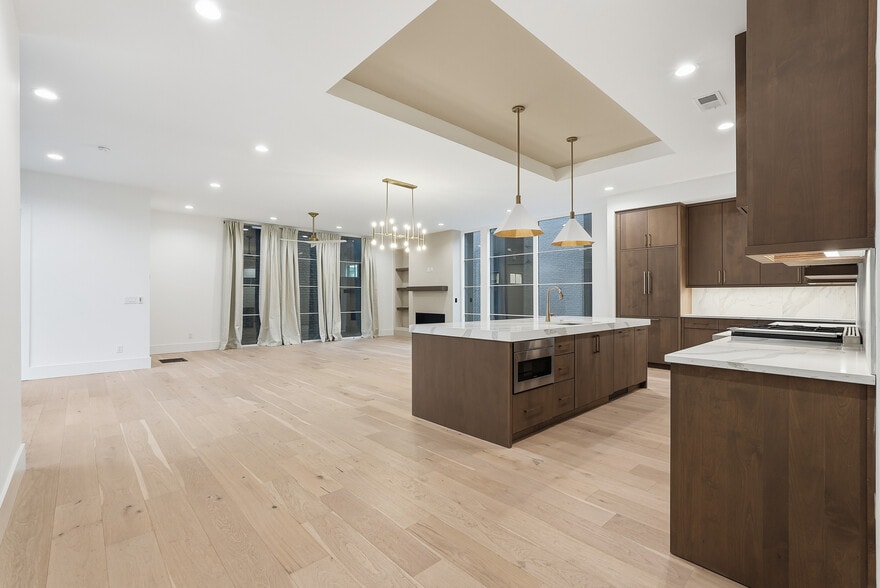 Expansive open concept living space with floor to ceiling windows and seamless flow into the kitchen - 3718 West End Ave
