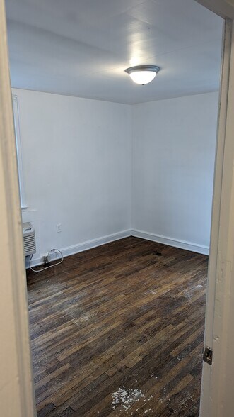 Larger bedroom from hallway - 1208 Preston St