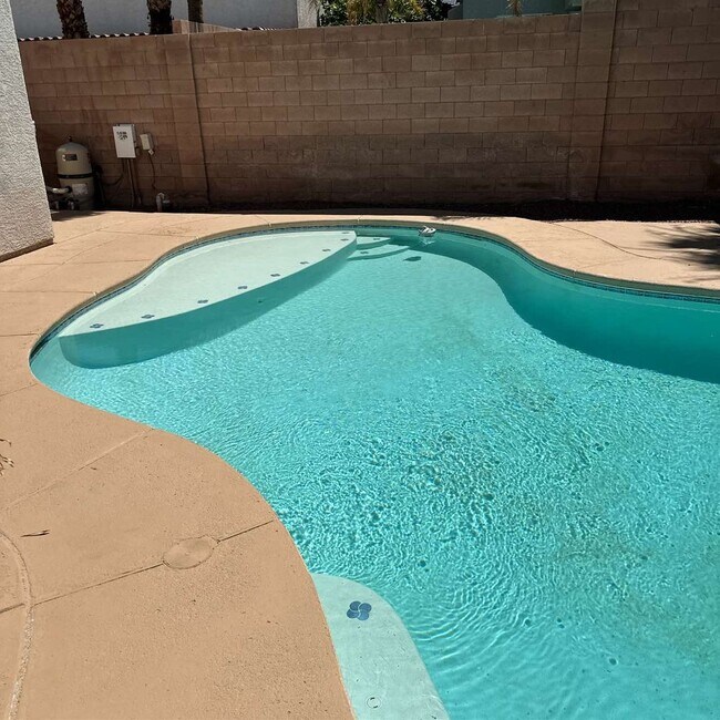Building Photo - Spacious 4-Bedroom Retreat with Poolside O...