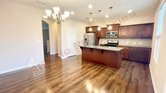 Building Photo - 3 Story Townhome 3 Bedrooms Rear Entry 2 Car Attached Garage with 1st Floor Bedroom, Community Po...