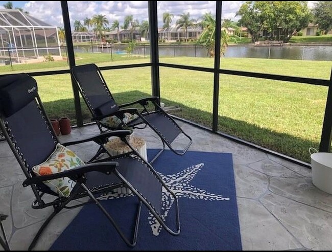 Enjoy your morning coffee on the screened in lanai overlooking the water. - 2321 SE 5th Ct