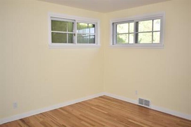 Building Photo - Updated house with original hardwoods and 2-car garage!