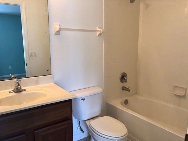 Building Photo - AVAILABLE NOW! Charming 2 Beds 2.5 Bath Townhome! 2 MASTER SUITES! Attached one car garage!! Extr...