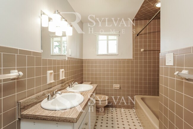 Building Photo - Welcome to this charming abode.