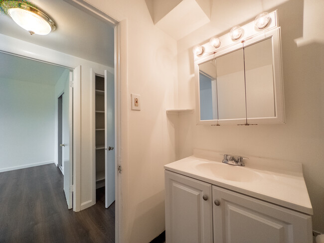 Bright bathroom with vanity sink - Whiteland Ave Apartments