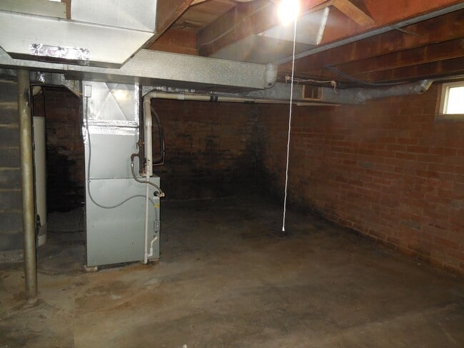 Building Photo - Two Bedroom House with Drive Under Garage!