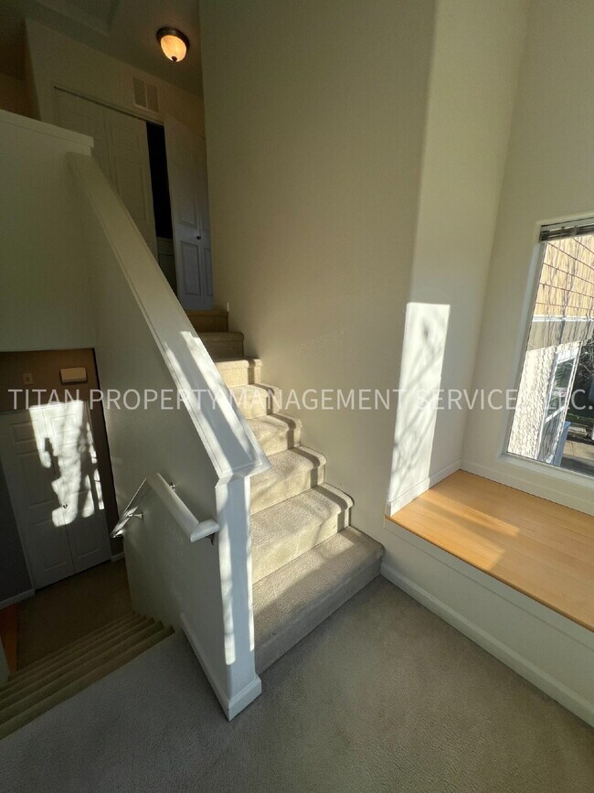 Building Photo - Beautiful Three Story Townhouse with Gas Fireplace, Balcony & 2-Car Garage