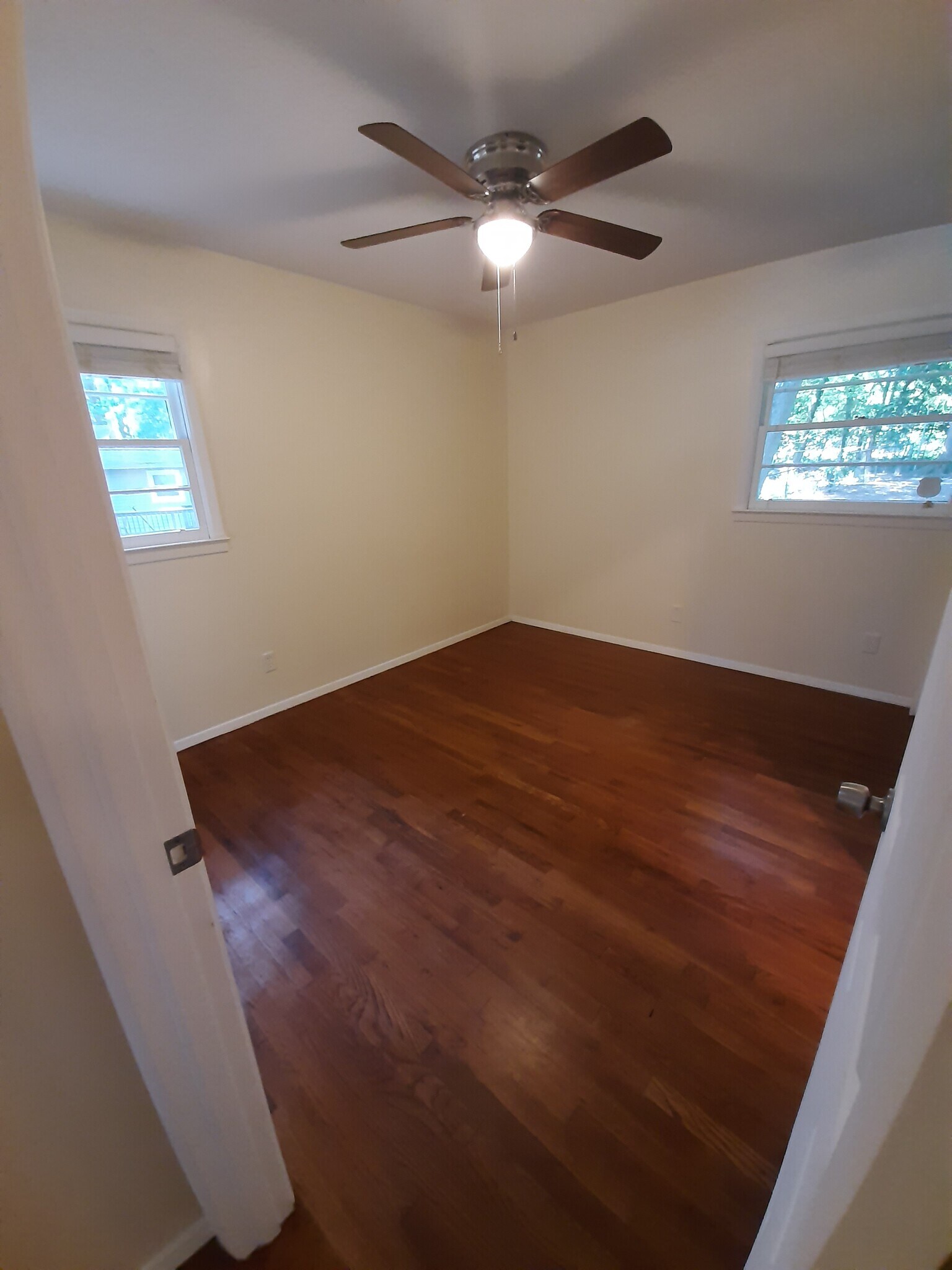 The 3rd/primary bedroom is at the end of the hallway to the right and faces the backyard. - 2955 Fantasy Ln