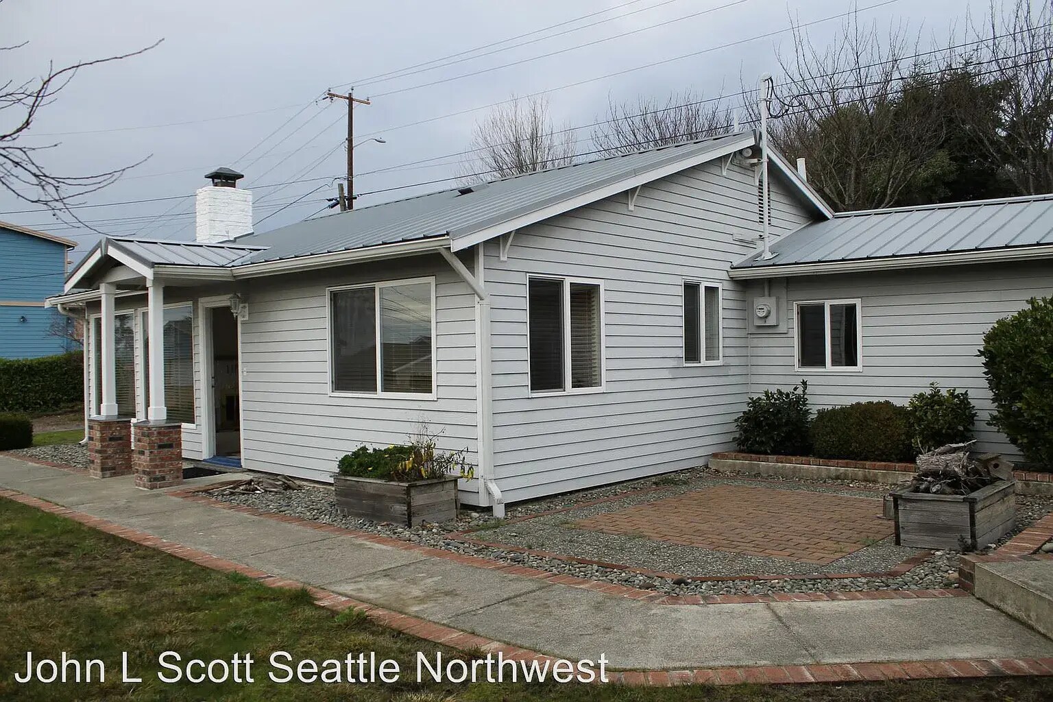 Front of home. Outdoor eating area. - 21204 3rd Ave S