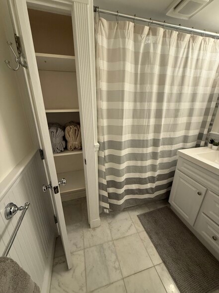 bathroom - linen closet with new towels - 382 Riverway St