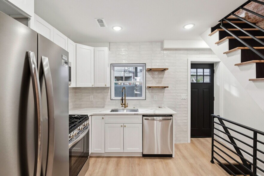 Kitchen with stone countertop and stainless steel appliances - 1544 S Bambrey St