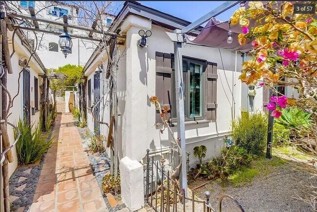 Building Photo - Charming, Fully Furnished Spanish-Style Du...