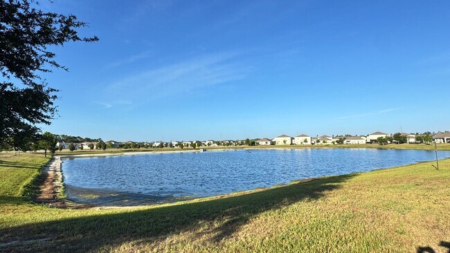 Building Photo - Available NOW! Spacious 4BD/2BA Haven in Villages at Harmony – Your Dream Home Awaits! WASHER & D...