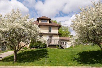 Building Photo - Bright, beautiful home with 3 garage spaces & tons of storage!