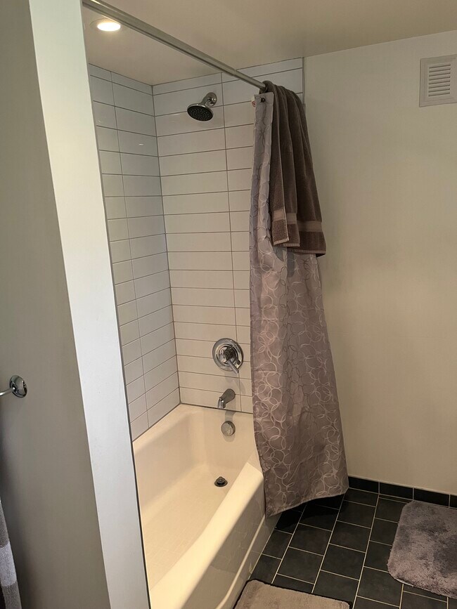 Tiled shower with cast iron tub - 6159 SE Steele St