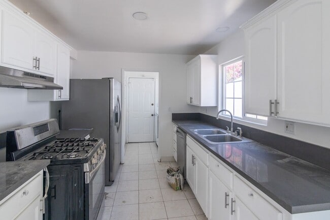Building Photo - 5-Bedroom, 3-Bathroom Home with Solar Pane...