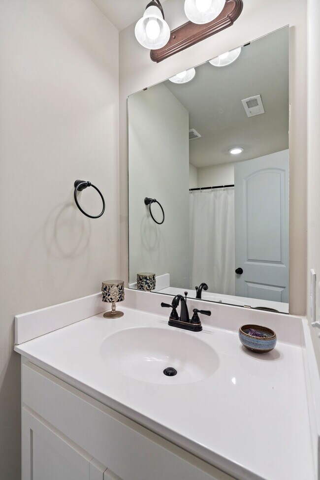 Building Photo - Available Now! Enjoy low-maintenance coastal living in this beautiful 2-bedroom, 2.5-bath townhom...
