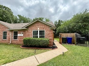 Building Photo - 4 Bedroom - 2 bath duplex located near campus and State Highway 9
