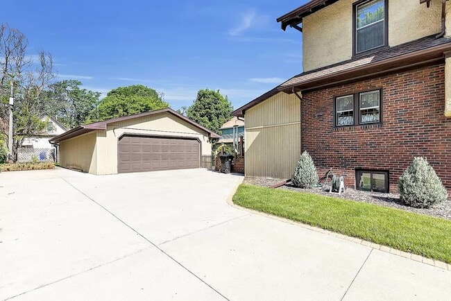 Rear of house with extra parking space, and extra large heated garage - 615 N Lawe St