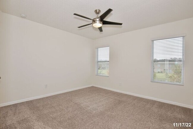 Building Photo - Spacious 3/2.5 Townhome with a 2 Car Garage and a Beautiful Pond View in Westwood Condos - Orlando!