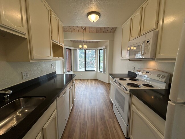 Building Photo - Large 2 BR / 2 BA featuring Cathedral Ceilings, Washer & Dryer, Plus Parking Included!