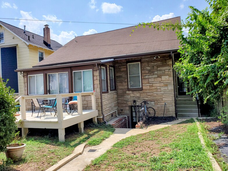 Back of house with deck, exterior entrance to the unit. - 2509 10th St NE