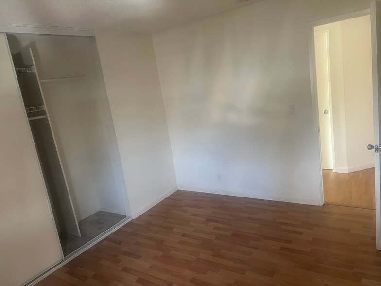 Bedroom, one, closet has built-in storage rack - 73 Silcreek Dr