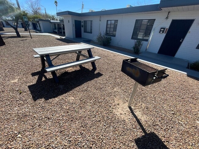 Building Photo - OPEN HOUSE! Remodeled Two Bedroom, End Unit with A/C and Large Fenced Yard