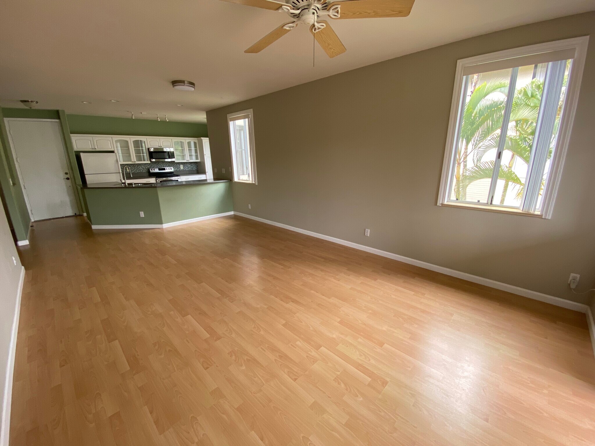 The living room has plenty of windows and natural light - 95-976 Wikao St