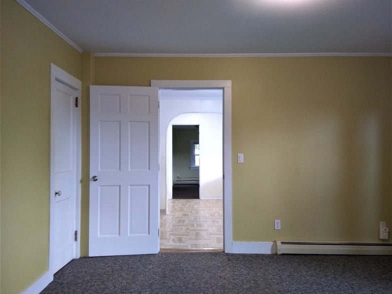 View from Living Room to kitchenette/rear bdr - 100 N Main St