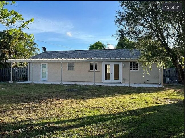 Building Photo - 2/2/1 home with a spacious fenced backyard...