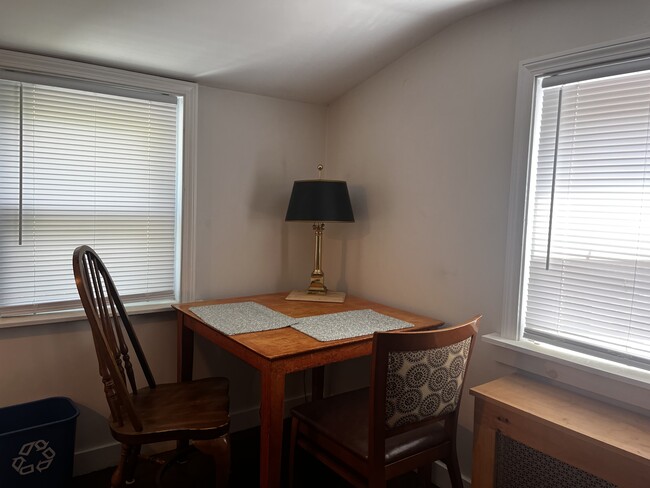 Kitchen with window blinds overlooks deck - 142 Page Rd