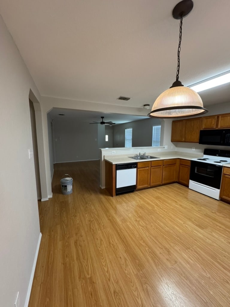 Kitchen view into living room - 8127 Willow Country