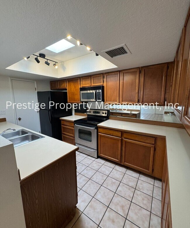 Building Photo - Totaling 3/3 With The Guest House; This Lovely Central Townhome is Everything You Need!