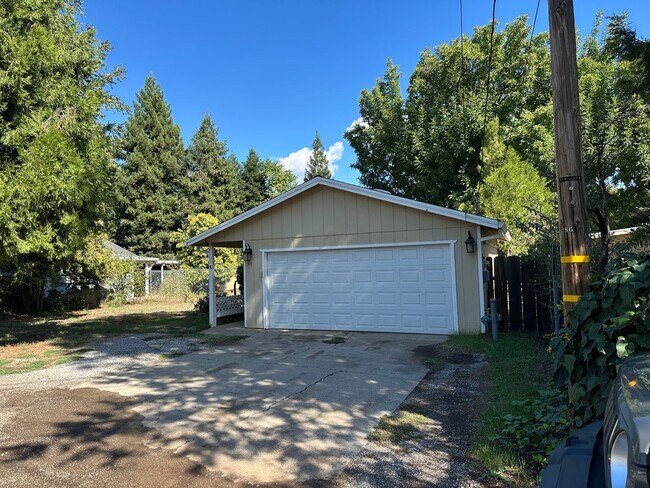 Building Photo - Charming Redding Home with Fireplace & Vau...