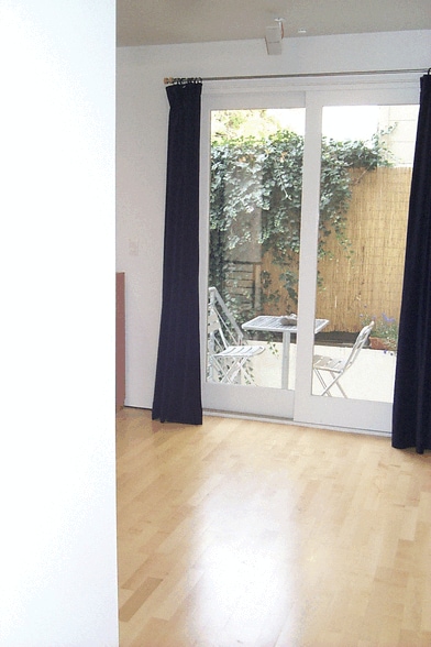 Lounge looks to rear courtyard - 12A Reno Pl