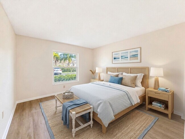 Building Photo - AVAILABLE NOW! Beautifully Renovated First-Floor Condo with Peaceful Screened Lanai