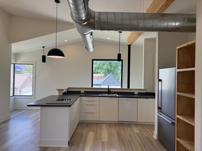 Building Photo - Vaulted Ceilings & Hardwood Floors in This Charming Indianapolis L